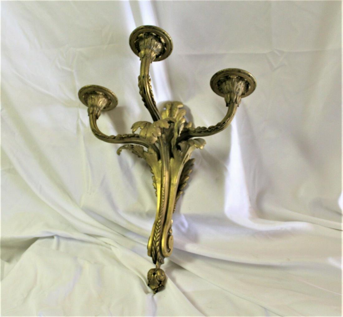 Antique Caldwell Sconce ,3 arm ,stamped , large size: A good size Caldwell Sconce with 3 arms . Gilded gold finish ,w/o any wiring or sockets . At 17 1/2" in ht and 16" wide . 8" deep at front . The bobeches are about 3 " dia . With Acanthus leaf design.