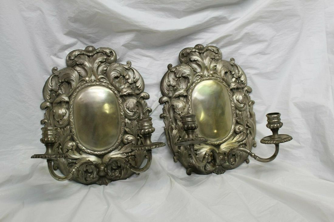 Silvered Sconces, Early American style . for candles: Great looking sconces made of Bronze with a polished Antique Silver patina . Appox 15 " in ht and 12 " across . Flat on the back side . Solid arms ,made for candles . Made for Antique reproduction Lig