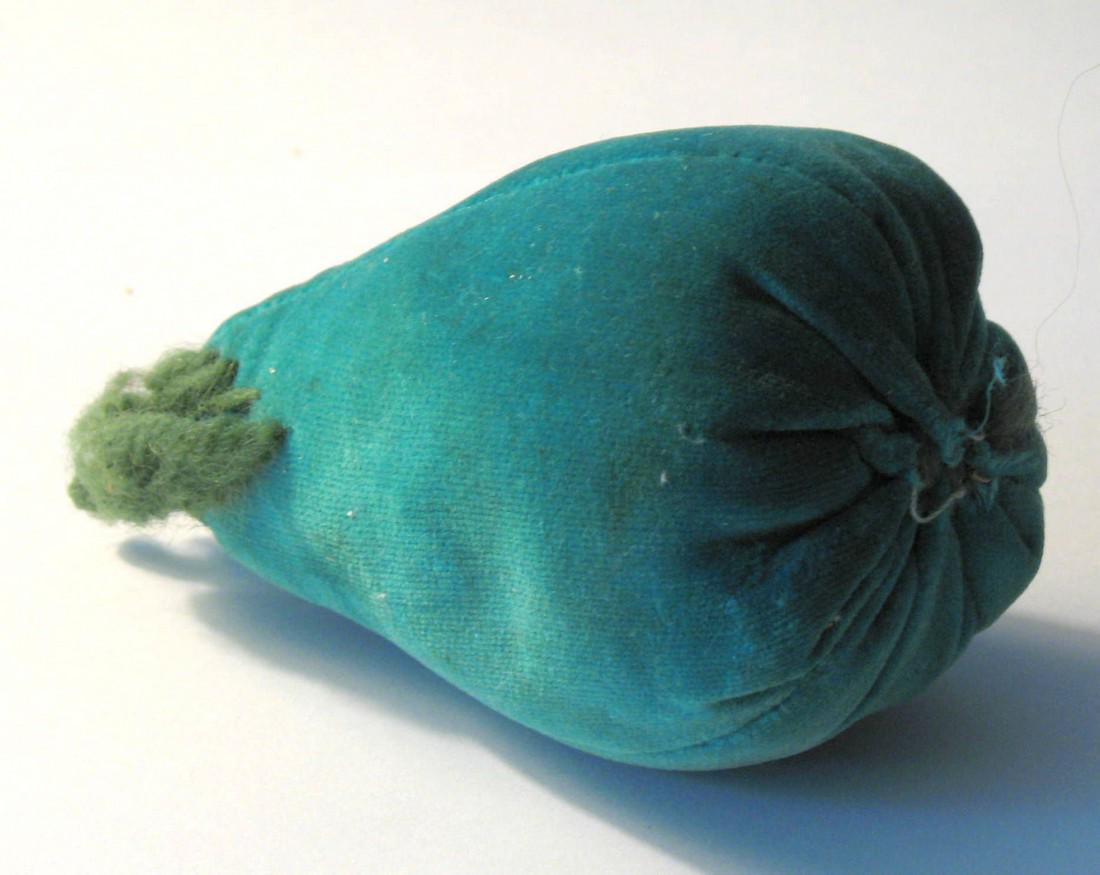 Vintage New England fruit pin cushion.: Title: Vintage New England fruit pin cushion. Provenance/Additional Info: Nice vintage New England pear shaped pin cushion in a great color. Dimensions: 2" x 4" Circa: 1940's Shipping: Domestic: Flat-