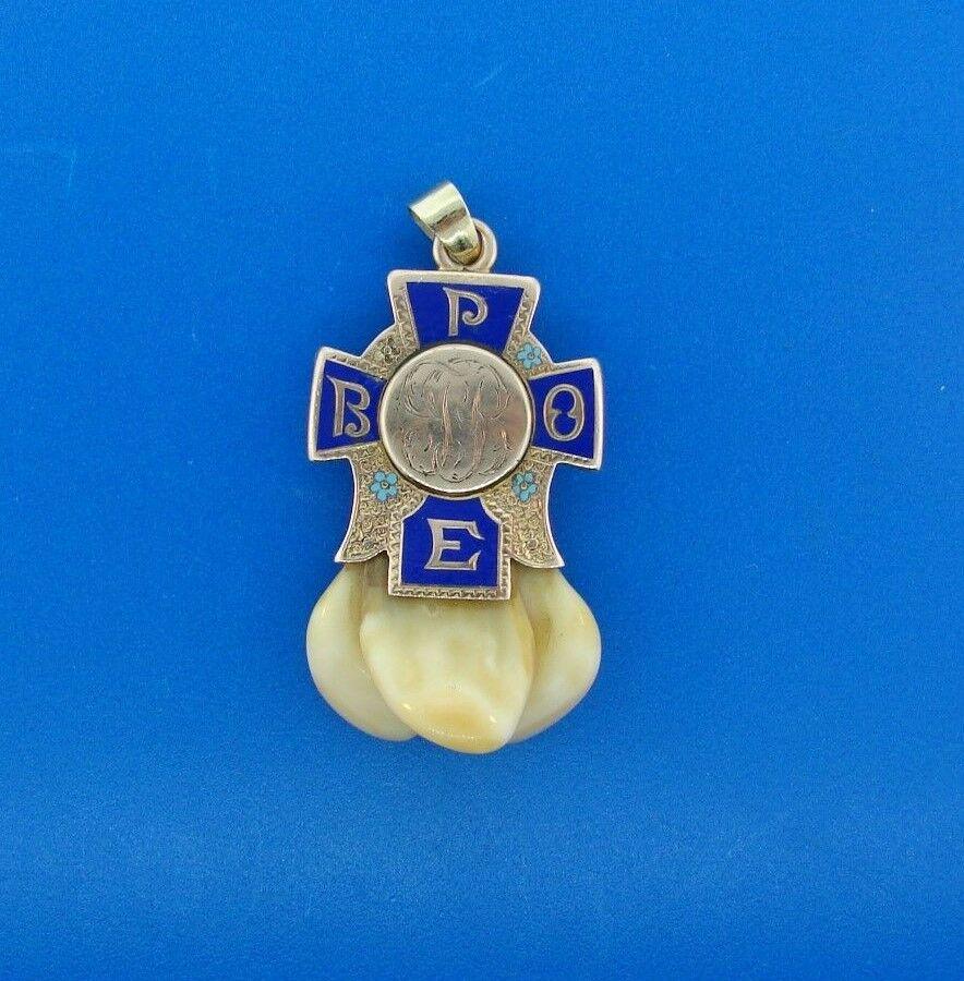 COOL 14k Yellow Gold, Enamel & Elk Teeth: DK 14k Yellow Gold, Elk teeth & Enamel Pendant · This is a must for any collector. · The weight is 26.8 grams. · The length with bail is 2 ½ inches. The width is 5/16 of an inch. · This is in gre