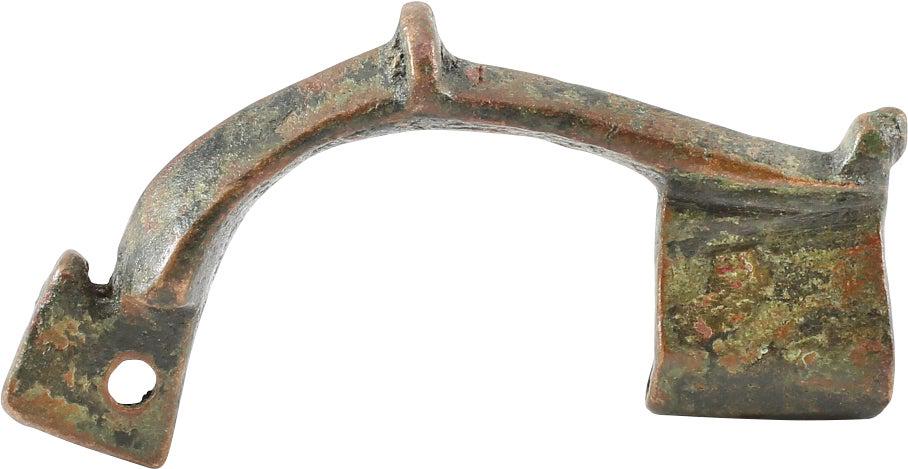 ANCIENT ROMAN FIBULA, 1ST-3RD CENTURY AD.: No Reserve! The time of Christ. Brass, arch from with transverse back crest and broad pin rest. 1 5/8” length. Elegant form. The original garment pin patented 2 millennia later as the â€œsaf