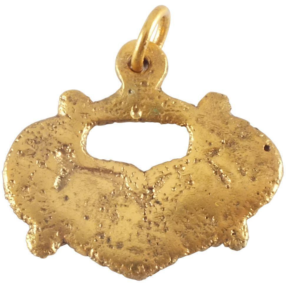 GOOD VIKING HEART NECKLACE 9th-10th CENT AD: Broad, full, very slightly domed section, and fully evolved form. Just under 1” width with nubs at the quarter points and pierced with a stylized heart. A heart within a heart. For Vikings, the 