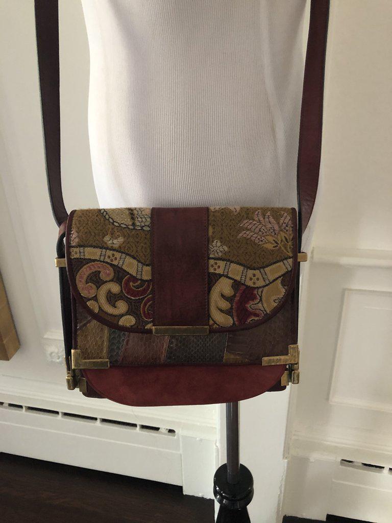 Etro Multicolor Shoulder Bag: A beautiful and unique cross body bag in multicolor...what makes this bag special is the use of different fabrications....an intricate woven print ,snakeskin leather and suede...in burgundy rich tones