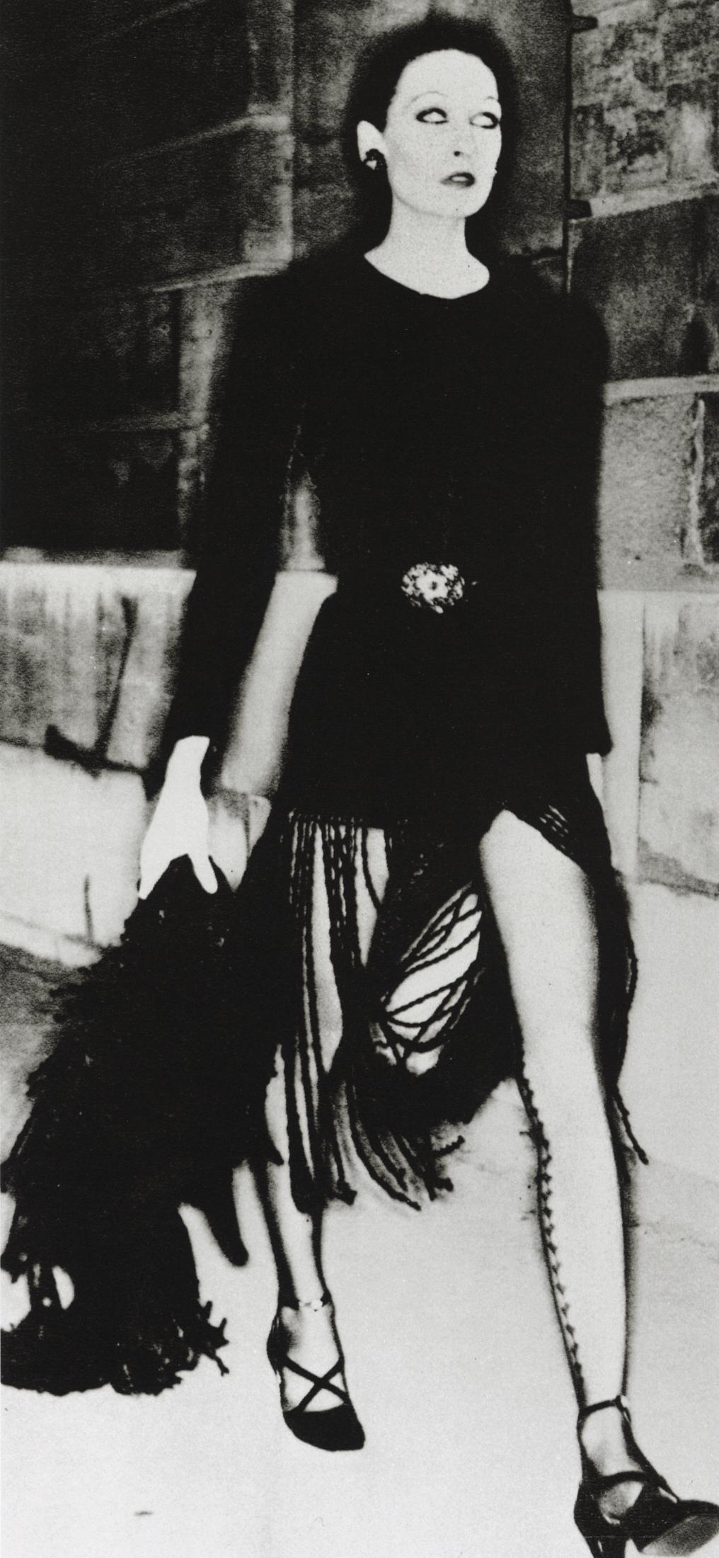 HELMUT NEWTON - Angelica Huston, Givenchy, 1971: Artist: Helmut Newton Title: Angelica Huston, Givenchy, French Vogue, 1971 Medium: Photo Litho, 2009, Italy Dimensions: 6.4x13.8" Description: Heat Wax Mounted on 12x16" Conservation Board Artist Bio: