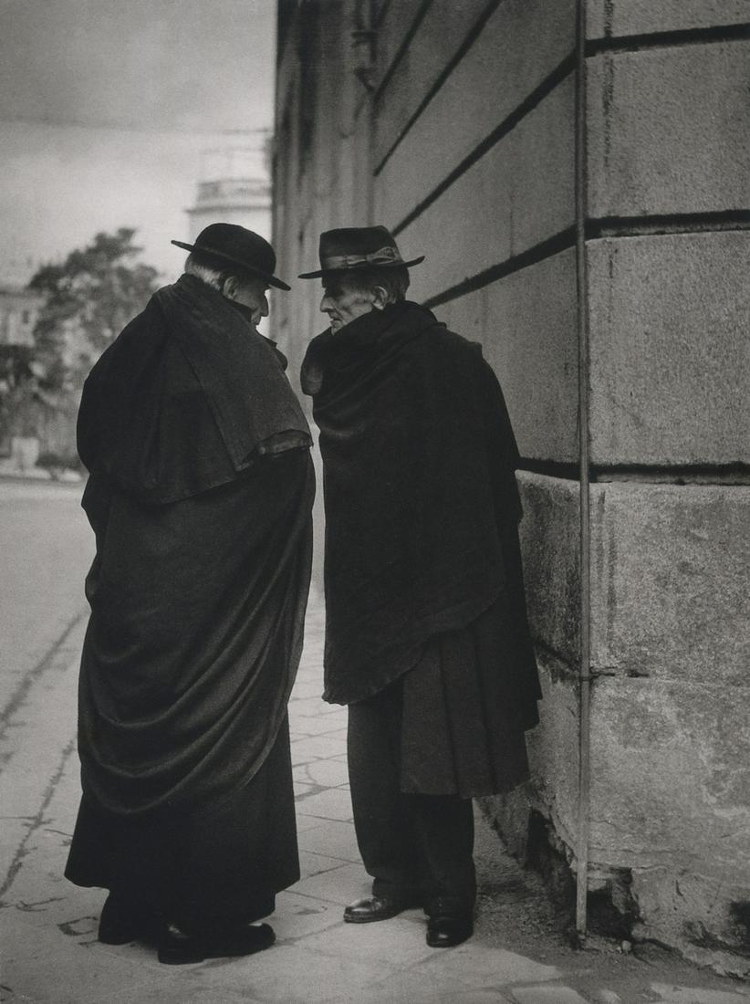 BRASSAI - Conversation in Madrid, 1950: Artist: Brassai Title: Conversation in Madrid, 1950 Medium: Photo Litho, 2008, China Dimensions: 6.25x8.35" Description: Heat Wax Mounted on 8.5x11" Conservation Board Artsit Bio: Brassai was a Hungar