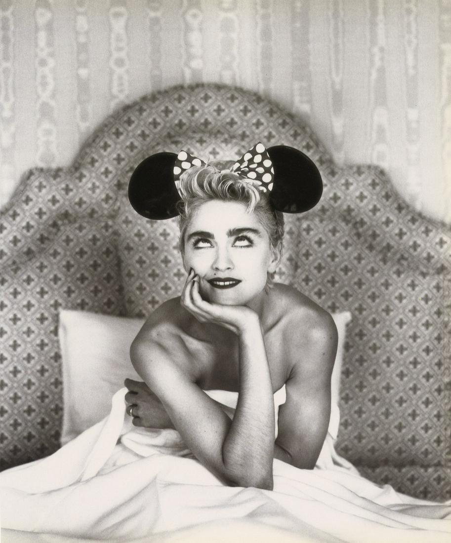 HERB RITTS - Madonna with Mickey Ears, 1987: Artist: Herb Ritts Title: Madonna with Mickey Ears, 1987 Medium: Photo Litho, 1989, Japan Dimensions: 11.7x13.85" Description: Heat Wax Mounted on 14x18" Conservation Board Artsit Bio: Herb Ritts (195