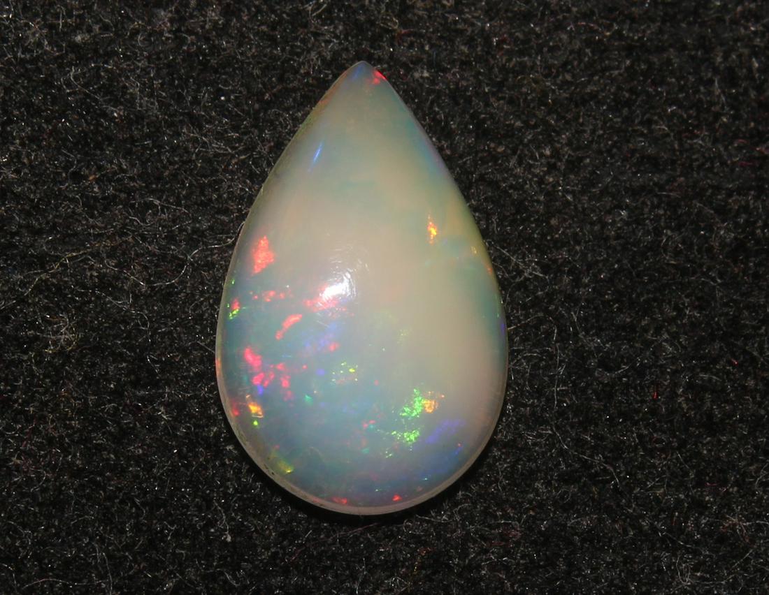 1.41 Ct Natural Ethiopia Opal: No Reserve! Title: 1.41 Ct Natural Ethiopia Opal Description: Gemstone: Natural Ethiopia OpalWeight: 1.41 CaratMeasurements: 11.9x7.5x3.3 mmShape : Pear CabochonTransparency: translucentColour : White