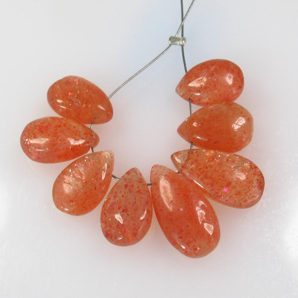 18.10 Ct Natural Drilled Sunstone Pear Beads: No Reserve! Title: 18.10 Ct Natural Drilled Sunstone Pear Beads Stone Clarity: Transparent Gemstone: Natural Sunstone Beads Carat Weight: 18.1 Size/Dimensions: 10.4x7.0 to 14.0x7.2 mm / 8 PC's Additio