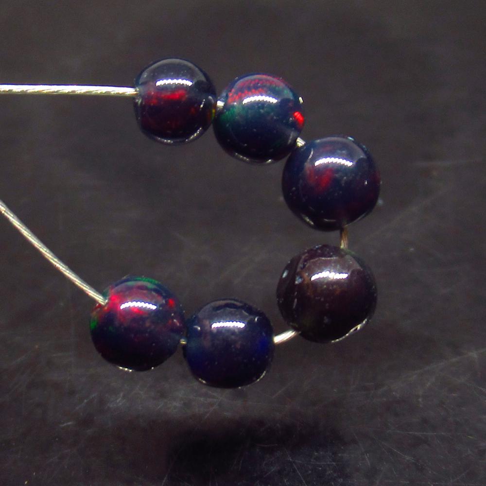 1.77 Ct Natural 6 Drilled Black Fire Opal Ball Beads: No Reserve! Title: 1.77 Ct Natural 6 Drilled Black Fire Opal Ball Beads Stone Clarity: Translucent Gemstone: Natural Black Opal Beads Carat Weight: 1.77 Size/Dimensions: 3.710 to 4.20 mm / 6 PC's Addi