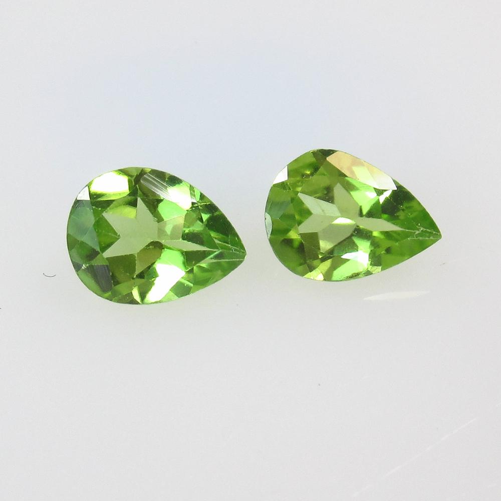 2.12 Ct Natural Pakistan Peridot Pear Pair: No Reserve! Title: 2.12 Ct Natural Pakistan Peridot Pear Pair Stone Clarity: VVS Gemstone: NaturalPeridot Carat Weight: 2.12 Size/Dimensions: 7.90 x 6.00 x 3.60 mm / 2 PC's Additional Information: Top