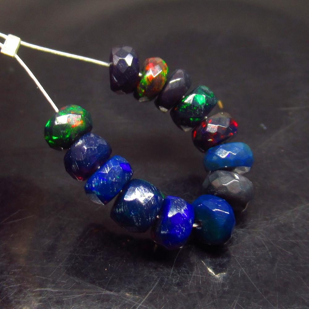4.42 Ct Natural 13 Drilled Faceted Black Opal Beads: No Reserve! Title: 4.42 Ct Natural 13 Drilled Faceted Black Opal Beads Stone Clarity: Translucent Gemstone: Natural Faceted Black Opal Beads Carat Weight: 4.42 Size/Dimensions: 4.50 to 5.00 mm / 13 PC