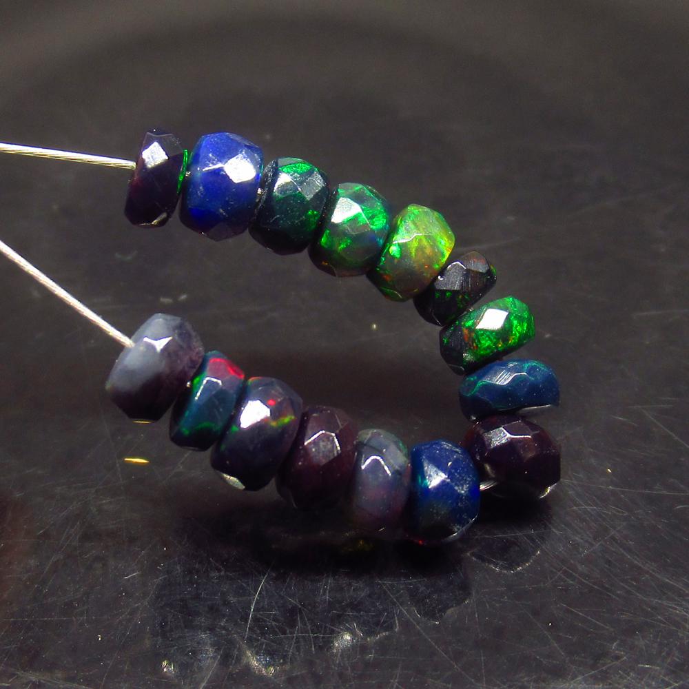 3.65 Ct Natural 15 Drilled Faceted Black Opal Beads: No Reserve! Title: 3.65 Ct Natural 15 Drilled Faceted Black Opal Beads Stone Clarity: Translucent Gemstone: Natural Faceted Black Opal Beads Carat Weight: 3.65 Size/Dimensions: 4.00 to 4.60 mm / 15 PC