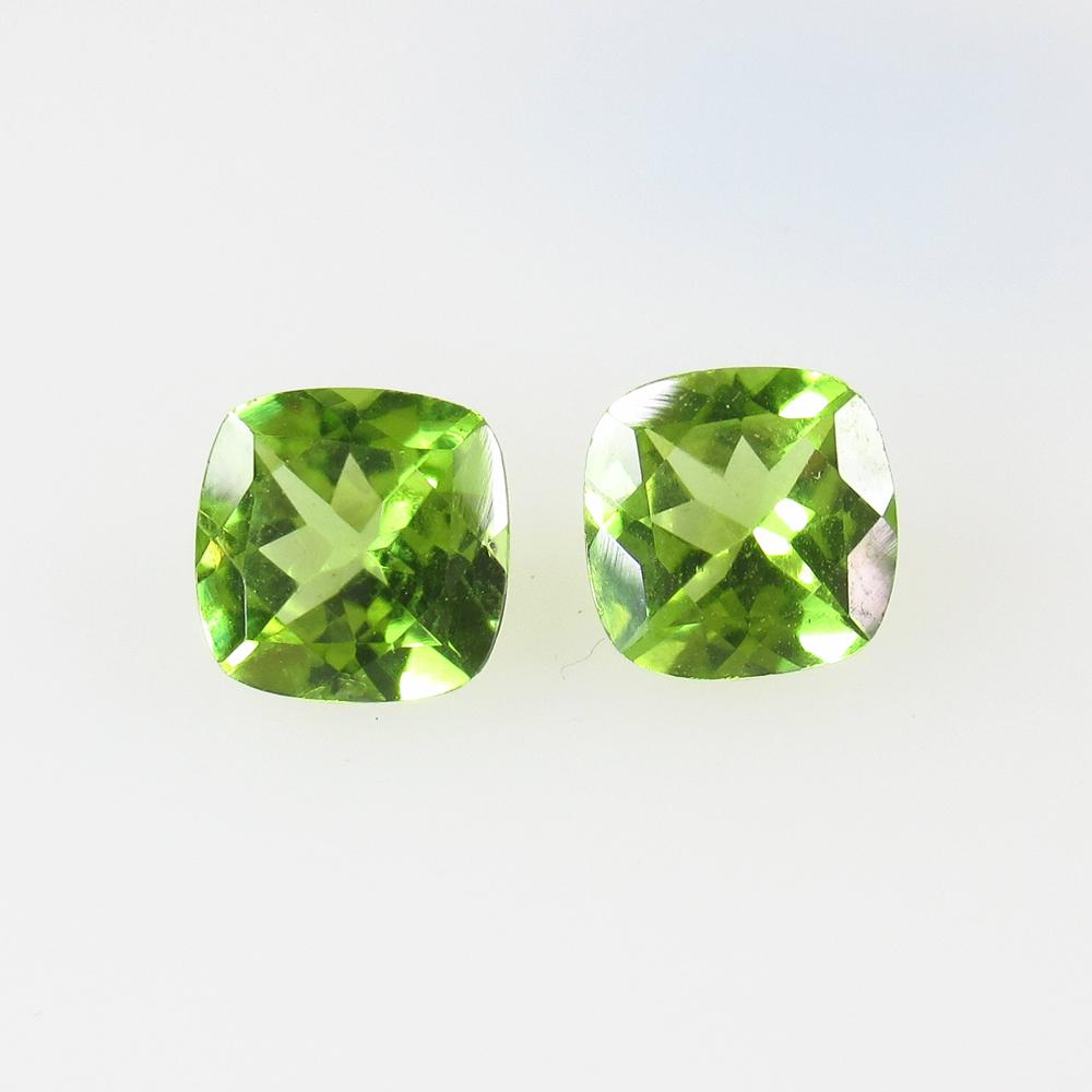 9.90 Ctw Natural Peridot Cushion Pair: No Reserve! Title: 9.90 Ctw Natural Peridot Cushion Pair Stone Clarity: VVS Gemstone:Peridot Carat Weight: 9.90 Size/Dimensions: 7.1x7.0 - 7.3x7.1 mm / 2 PC's Additional Information: Top Class Luster 