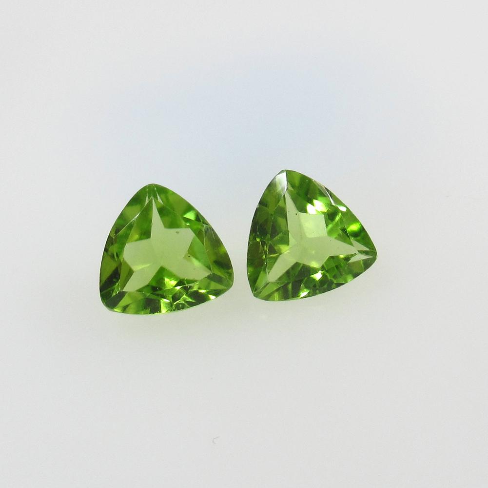 2.55 Ctw Natural Peridot Trillion Pair: No Reserve! Title: 2.55 Ctw Natural Peridot Trillion Pair Stone Clarity: VVS Gemstone:Peridot Carat Weight: 2.55 Size/Dimensions: 7.20 x 7.20 x 3.60 mm / 2 PC's Additional Information: Top Class Luste