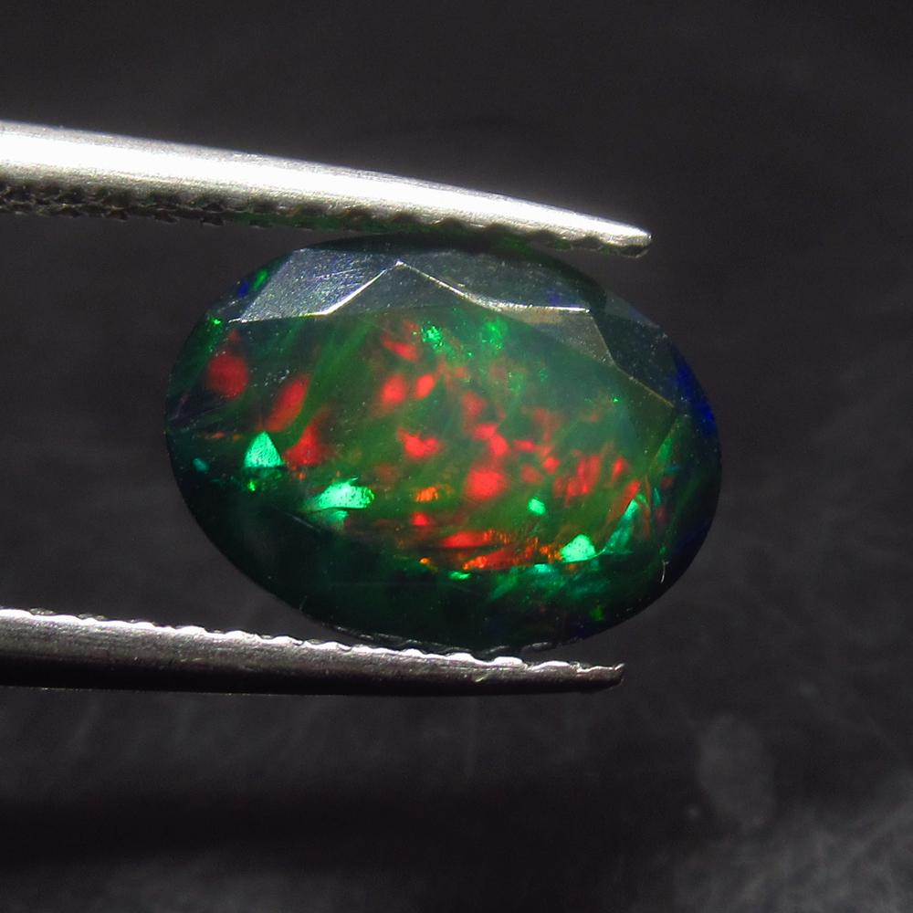 1.46 Ctw Natural Ethiopian Black Fire Opal Oval Cut: No Reserve! Title: 1.46 Ctw Natural Ethiopian Black Fire Opal Oval Cut Stone Clarity: Translucent Gemstone:Black Opal Carat Weight: 1.46 Size/Dimensions: 10.20 x 7.70 x 4.40 mm Additional Information: