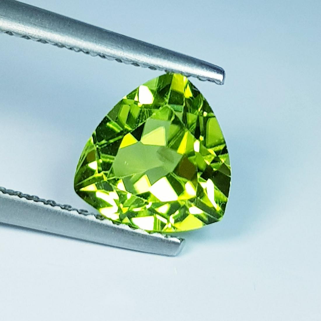 1.90 Ct Natural Peridot Trillion Cut: No Reserve! Title: 1.90 Ct Natural Peridot Trillion Cut Color/Clarity: IF - VVS Gemstones: Loosegemstone Carat Weights: 1.9 Size/Dimensions: 7.90 x 7.80 x 4.70 Additional Information: Trillion / Pakis
