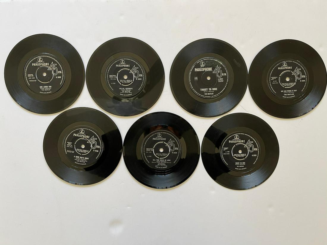 SEVEN BLACK PARLOPHONE BEATLES 45s: SEVEN BLACK PARLOPHONE BEATLES 45s. SHE LOVES YOU. HELLP, GOODBYE. TICKET TO RIDE X 2. WE CAN WORK IT OUT. A HARD DAYS NIGHT. ALL YOU NEED IS LOVE. RECORDS ALL VARIOUS FROM GOOD TO VG+ TO NM. Reserve: