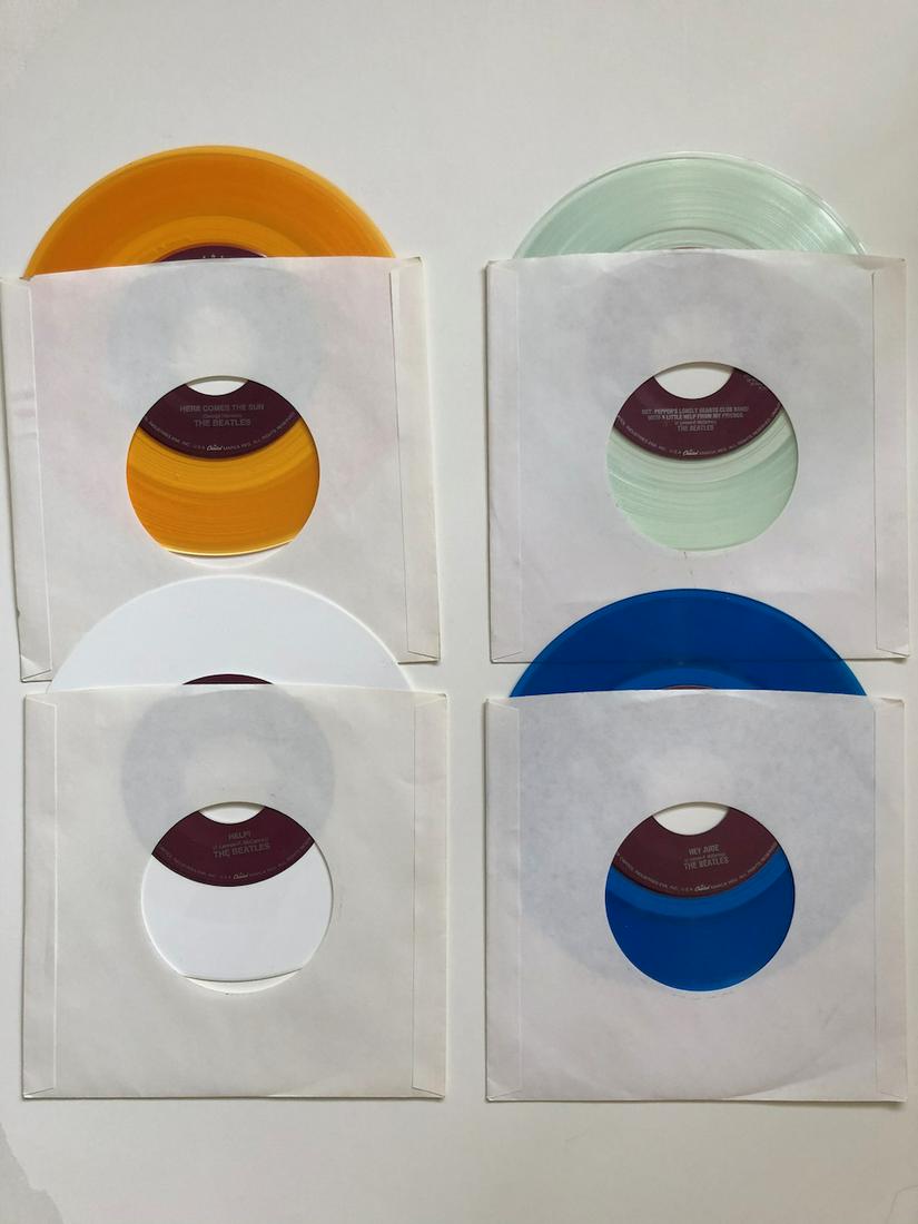 4 BEATLES JUKEBOX VERSION 45s: 4 BEATLES COLORED VINYL. JUKEBOX VERSION 45s. NEVER PLAYED OR LOADED IN JUKEBOX. YOU GET: HERE COMES THE SUN, HELP!, SGT. PEPPERS, HEY JUDE. THESE VERSIONS ARE SUPER RARE AND SIMPLY HARD TO FIND IN TH