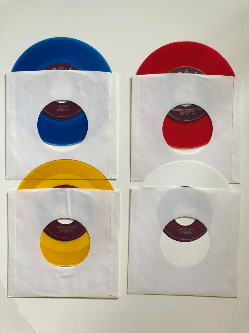 4 BEATLES JUKEBOX VERSION 45s: 4 BEATLES COLORED VINYL. JUKEBOX VERSION 45s. NEVER PLAYED OR LOADED IN JUKEBOX. YOU GET: SOMETHING, YELLOW SUBMARINE, STRAWBERRY FIELDS FOREVER, A HARD DAYS NIGHT. THESE VERSIONS ARE SUPER RARE AND S