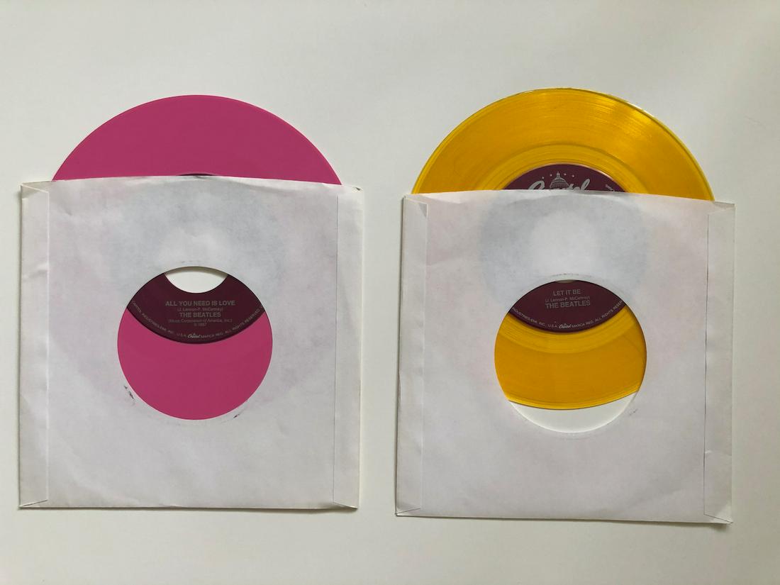 2 BEATLES JUKEBOX VERSION 45s: 2 BEATLES COLORED VINYL. JUKEBOX VERSION 45s. NEVER PLAYED OR LOADED IN JUKEBOX. YOU GET: ALL YOU NEED IS LOVE, LET IT BE. THESE VERSIONS ARE SUPER RARE AND SIMPLY HARD TO FIND IN THIS PRISTINE CONDIT