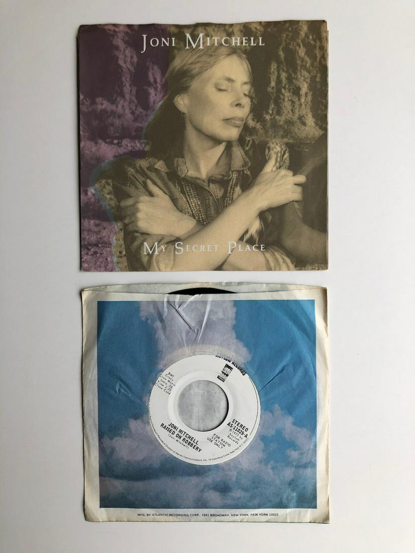 JONI MITCHELL PICTURE SLEEVE AND DJ PROMO: JONI MITCHELL PICTURE SLEEVE AND DJ PROMO RECORD SET INCLUDING: Joni Mitchell – Raised On Robbery Label: Asylum Records – AS-11029-A Format: Vinyl, 7", 45 RPM, Promo Country: US Released: 1973 - A
