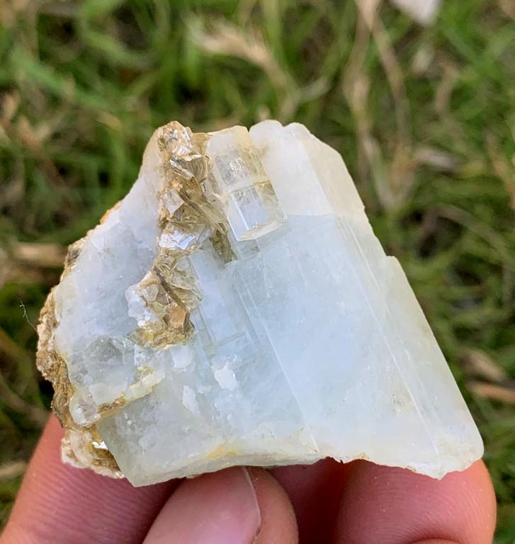 29 Gram Beautiful Natural Aquamarine Specimen: Title: 29 Gram Beautiful Natural Aquamarine Specimen Treatment: Natural Weight: 29 Gram Size/Dimensions: 37x35x18 mm Origin: Pakistan Reserve: $20.00 Shipping: Domestic: Flat-rate of $15.00 to anywher