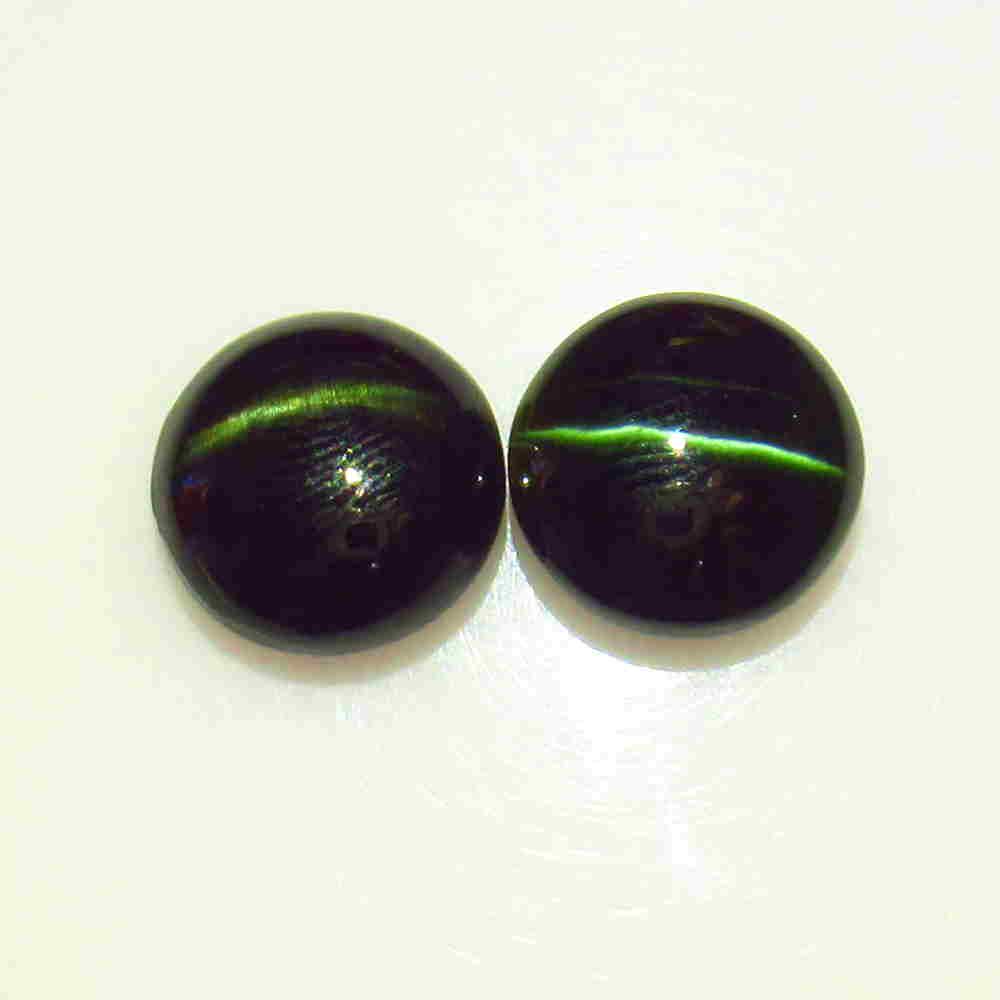 14.93 Cts Natural Kornerupine Catseye Matching Pair: Title: 14.93 Cts Natural Kornerupine Catseye Matching Pair Additional Information: Sharp Line / Round Cabochon / Treatment - None Origin: India Materials: Gemstones Dimensions: 12.20 x 12.20 x 5.80 mm