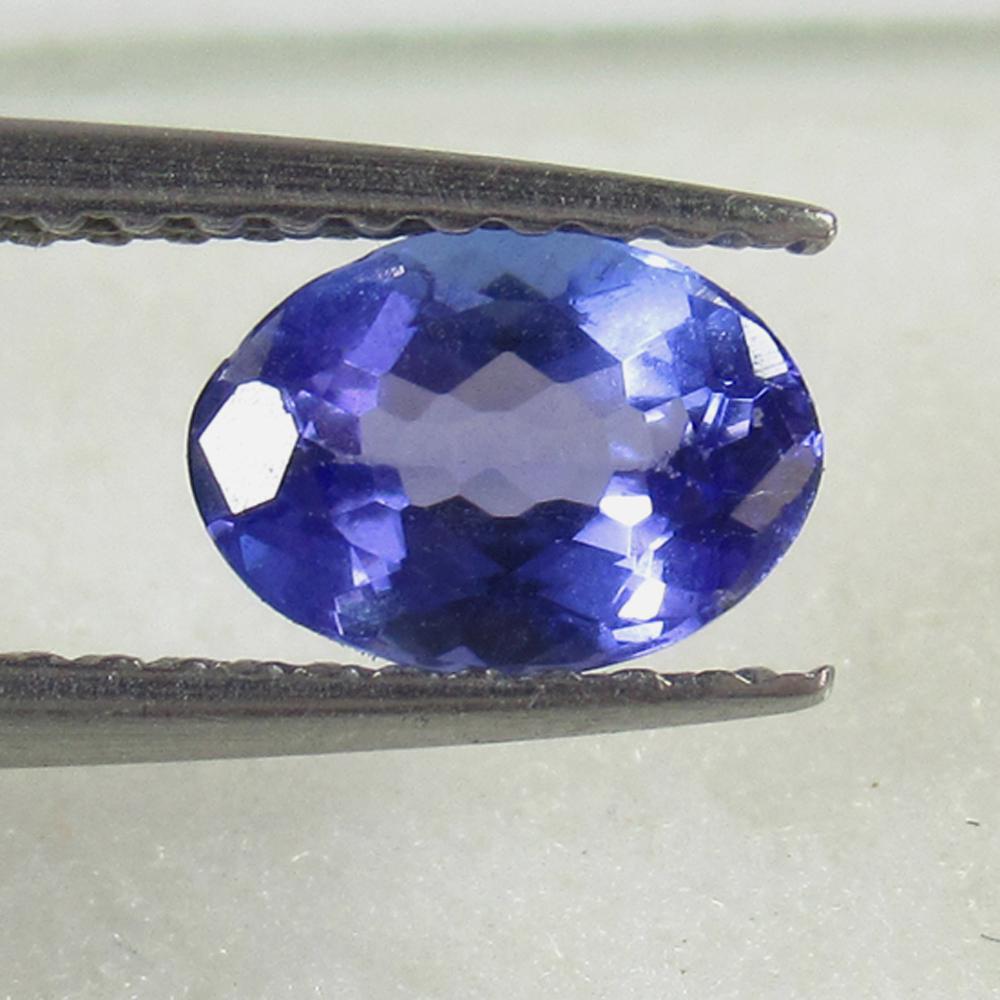 0.82 Cts Natural Tanzanite: Title: 0.82 Cts Natural Tanzanite Gemestone: Tanzanite Carat Weight: 0.82 Dimensions: 7.00 x 5.00 x 3.20 mm Additional Information: Shape - Oval Mixed Cut // Pieces - 1 // Origin - Tanzania // Treatme