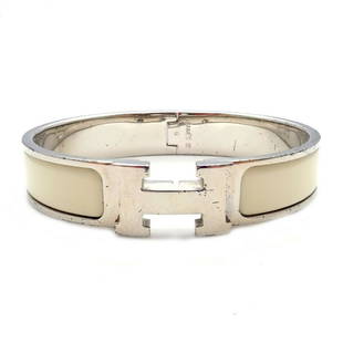 Rare! Authentic Hermes Paris Clik Clak Cream Enamel: Rare! Authentic Hermes Paris Clik Clak Cream Enamel Bangle Bracelet G 6.25" Rare! Authentic Hermes Paris Clik Clak Cream Enamel Bangle Bracelet G 6.25" Product Description About This Piece: 