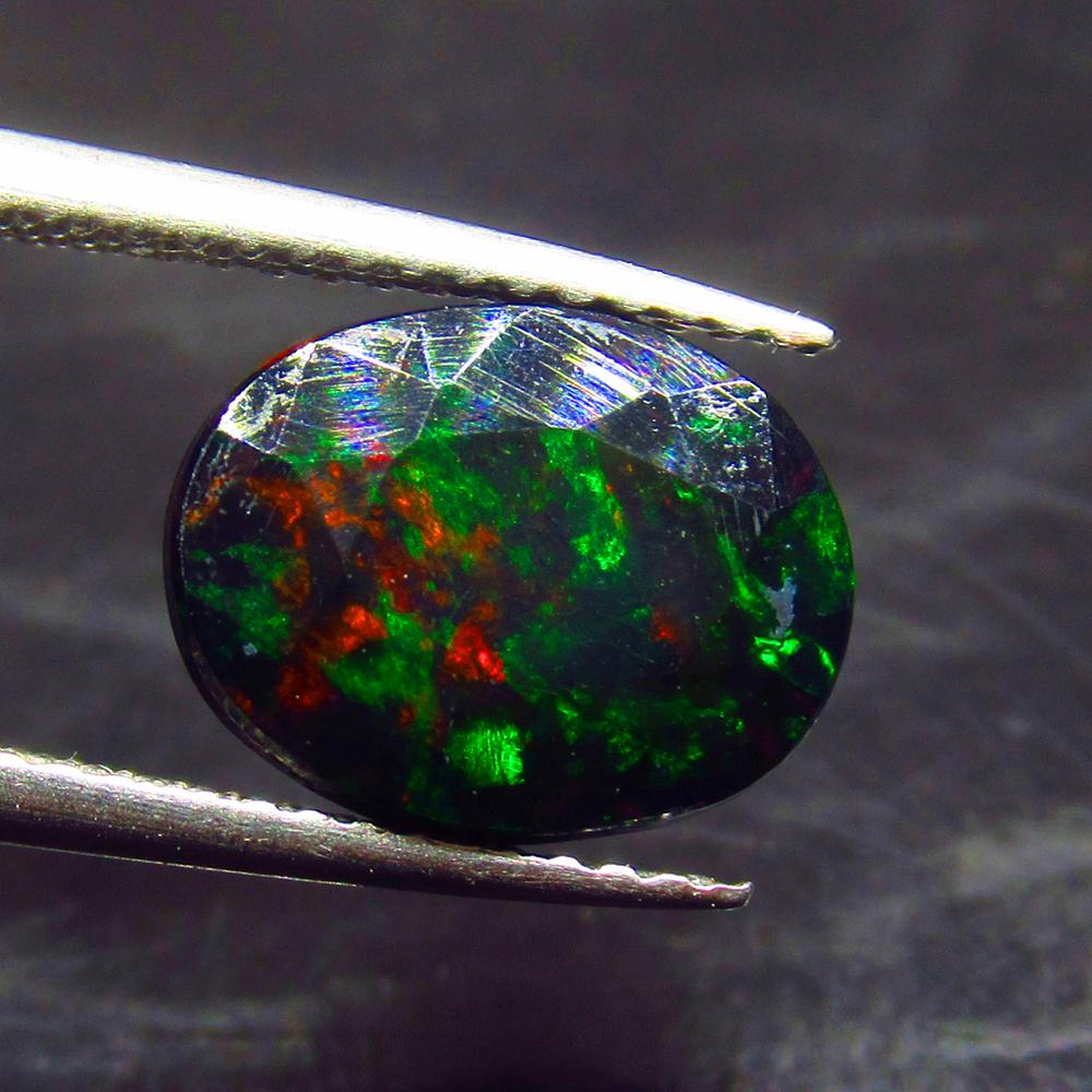 2.01 Ct Natural Ethiopian Black Fire Opal Oval Cut (1 of 3)