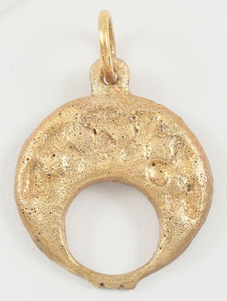 ANCIENT VIKING LUNAR PENDANT C.900-1050 AD: Gilt bronze, formed as the crescent moon with the tips touching or holding a small semicircle and forming a small triple scallop. The raised Edge field with five circles. Both arrangements had astrolo