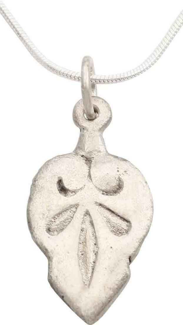 VIKING HEART PENDANT NECKLACE C.1000 AD JEWELRY: A good example in its fully evolved form. Near flat section and fully evolved cusped top scrolling over the trefoil motif in the field. Just over 1" height, made by the open face mold technique. The i