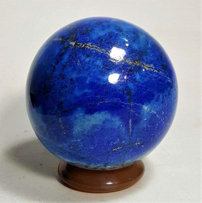 AAA Quality Deep Blue Lapis Lazuli Sphere - 925 Grams: Title: AAA Quality Deep Blue Lapis Lazuli Sphere - 925 Grams Gemstones: Mineral Carat Weights: 925 Grams Size/Dimensions: Diameter 84 Additional Info: AAA Quality Deep Blue Lapis Lazuli Sphere - 925 G
