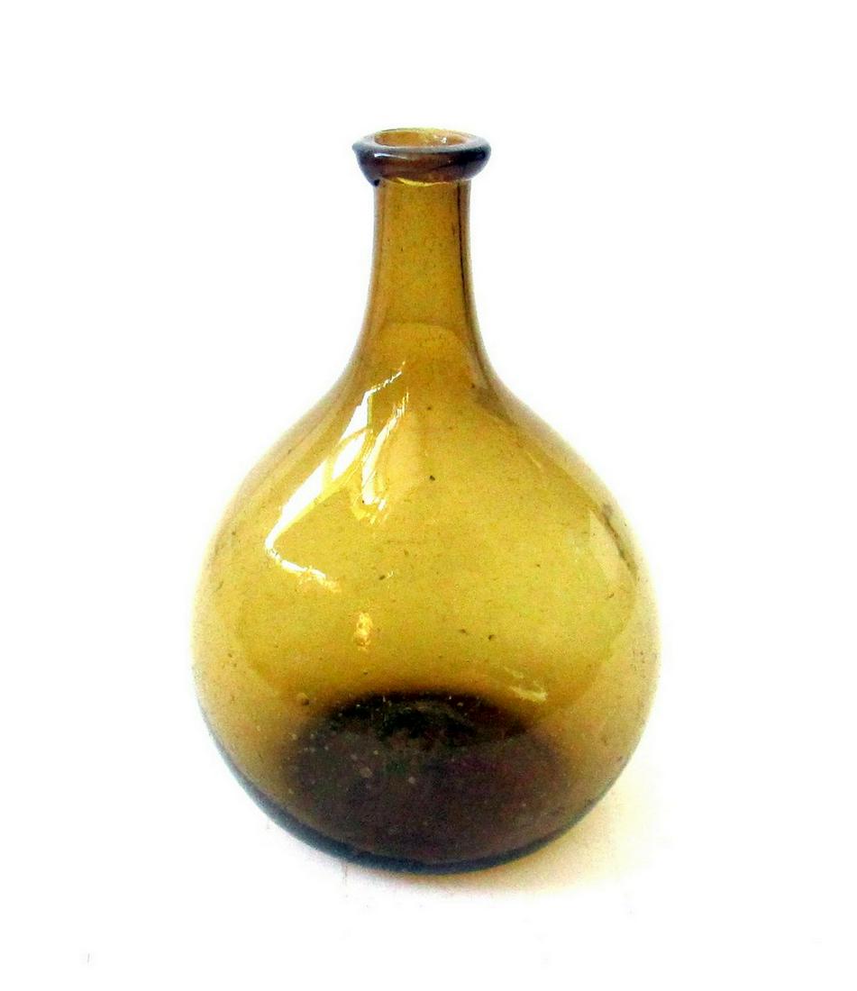 AMBER CHESTNUT FLASK: Title: AMBER CHESTNUT FLASK Date: C 1810-30 Dimensions: 7 3/4"H X 5 1/4"W X 3 7/8"D Material: Glass Provenance/Additional Info: Perfect condition, no chips, blowouts or cracks. Free blown classic tear