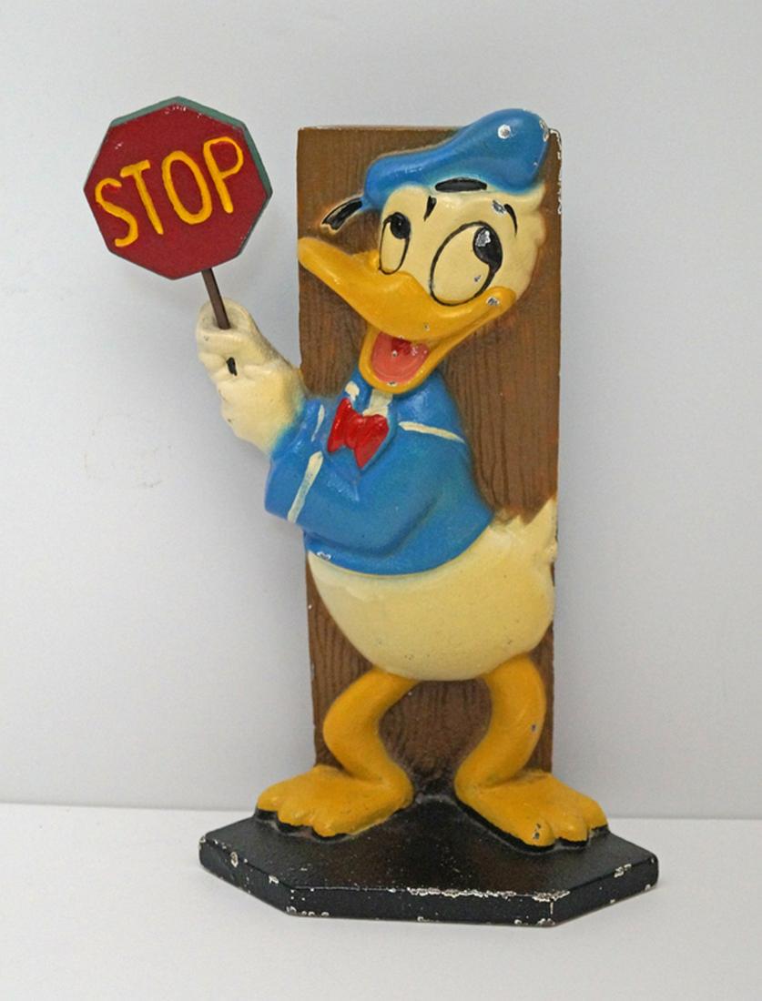 Vintage Donald Duck Cast Iron Disney Doorstop: Title: Vintage Donald Duck Cast Iron Disney Doorstop Dimension: 8 1/2" tall x 5 1/4" wide. Provenance/Additional Info: A whimsical portrayal of Donald Duck, the beloved cartoon character created in 19