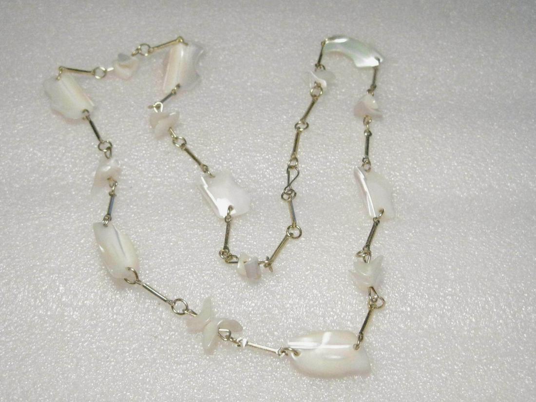 Vintage Natural Mother-of-Pear; l Necklace, Goldtone: Vintage but exact age unknown - goldtone bar links with natural mother-of-pearl polished shell links - large piece alternating with double smaller pieces. Shimmer beautifully. It is 26" long and the l