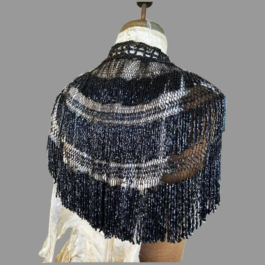 Antique Victorian all Onyx Jet hand beaded Cape Fish: A Real Stunning late 1800 Early 1900 Victorian Hand beaded onyx Mantle Mourning cape. On beaded on black fine cord, Fishnet style. hanging beaded Tassels. Very nice condition for its age, few missing 