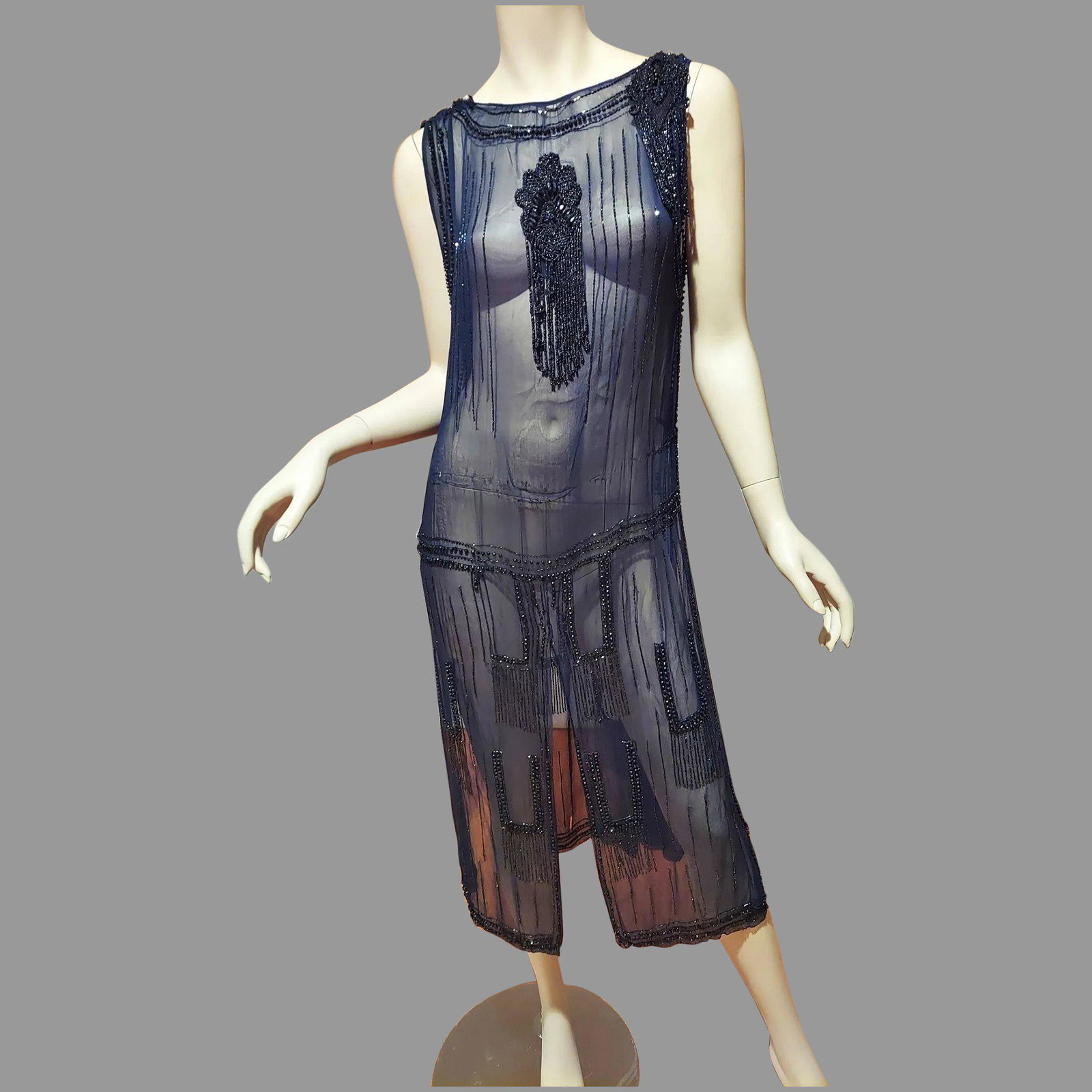 Antique Museum 1910 beaded Tabard Flapper dress: A Stunning heavily beaded Antique Museum Tabard dress . Onyx Beaded on a silk chiffon/ Stunning hand embroidered beads design All Authentic hand stitched. It is more amazing in real Life. A Size M In 