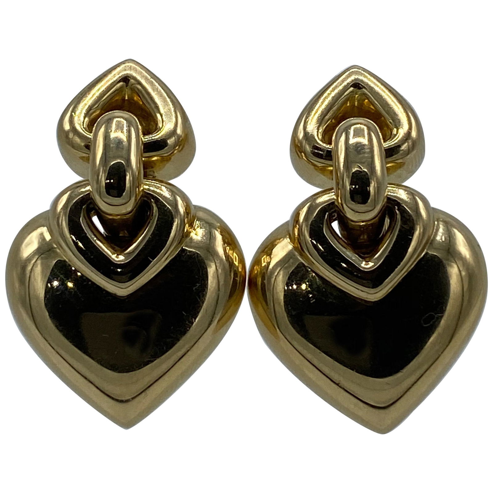 Vintage Bulgari Yellow Gold Heart Earrings: Featuring circa 1990’s, 18K yellow gold heart shaped earrings. Signed by BVLGARI, stamped 750 and serial number BA78942. Creator Bvlgari Metal 18k Gold,Yellow Gold Weight 30.4 g Dimensions Width: 0.