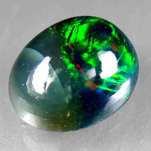 1.70 CTS NATURAL ETHIOPIAN BLACK OPAL OVAL SHAPE LOOSE: Title: 1.70 CTS NATURAL ETHIOPIAN BLACK OPAL OVAL SHAPE LOOSE GEMSTONES Carat Weights: 1.7 Size/Dimensions: 9.7 x 7.4 x 4.9 MM Reserve: $10.00 Shipping: Domestic: Flat-rate of $10.00 to anywhere withi