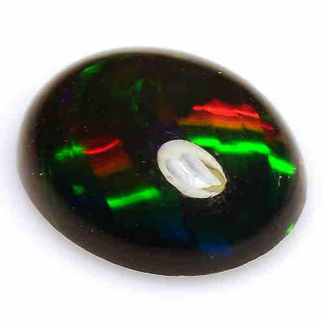 1.44 CTS NATURAL ETHIOPIAN BLACK OPAL OVAL SHAPE LOOSE: Title: 1.44 CTS NATURAL ETHIOPIAN BLACK OPAL OVAL SHAPE LOOSE GEMSTONES Carat Weights: 1.44 Size/Dimensions: 10.0 x 7.8 x 3.7 MM Reserve: $10.00 Shipping: Domestic: Flat-rate of $10.00 to anywhere wit