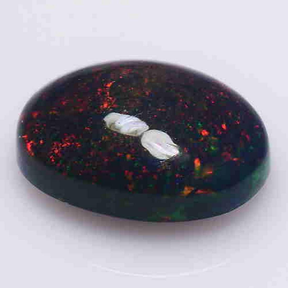 0.95 CTS NATURAL ETHIOPIAN BLACK OPAL OVAL SHAPE LOOSE: Title: 0.95 CTS NATURAL ETHIOPIAN BLACK OPAL OVAL SHAPE LOOSE GEMSTONES Carat Weights: 0.95 Size/Dimensions: 8.8 x 6.5 x 3.2 MM Reserve: $15.00 Shipping: Domestic: Flat-rate of $10.00 to anywhere with