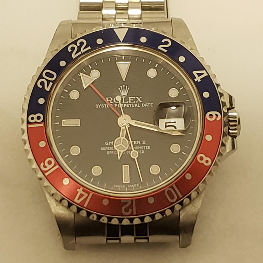 ROLEX GMT BLUE AND RED PEPSI: Title: ROLEX GMT BLUE AND RED PEPSI Description: ROLEX SS GMT BLUE AND RED MADE 1999 /A772171 /16710 WITH BOX AND PAPER Date/Period: 1999 Materials: SS Additional Information: BOX AND PAPER Reserve: $