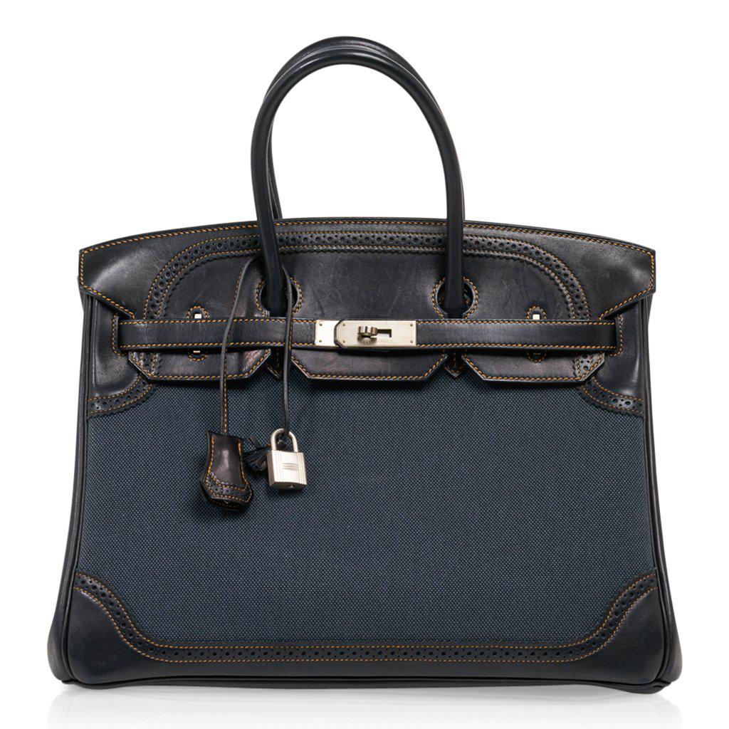 Hermes Birkin 35 Ghillies Denim Fonce Toile / Black: Guaranteed authentic Limited Edition Hermes Birkin 35 Ghillies bag featured in rare Denim Fonce Toile. Accentuted with Black Veau Evercalf and Palladium brushed hardware.. A rare Birkin bag to add to