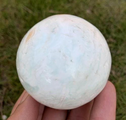 263 Gram Amazing Natural Caribbean Calcite Sphere: Title: 263 Gram Amazing Natural Caribbean Calcite Sphere Healing Mineral Treatment: Natural Weight: 263 Gram Size/Dimensions: 56 mm Origin: Pakistan Reserve: $30.00 Shipping: Domestic: Flat-rate of $1