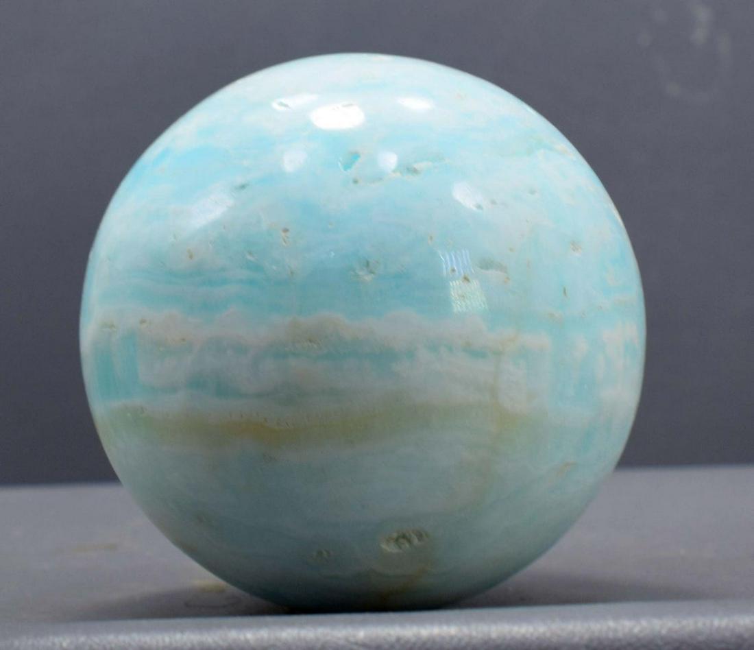 Carribean Calcite Sphere Ball , Blue Calcite Gemstone: Materials: carribean calcite, calcite Description Carribean Calcite Sphere Ball , Blue Calcite Gemstone Crystal Stone - 664 Gram , 76*76*76 mm This listing is for this exact Caribbean calcite aragonit