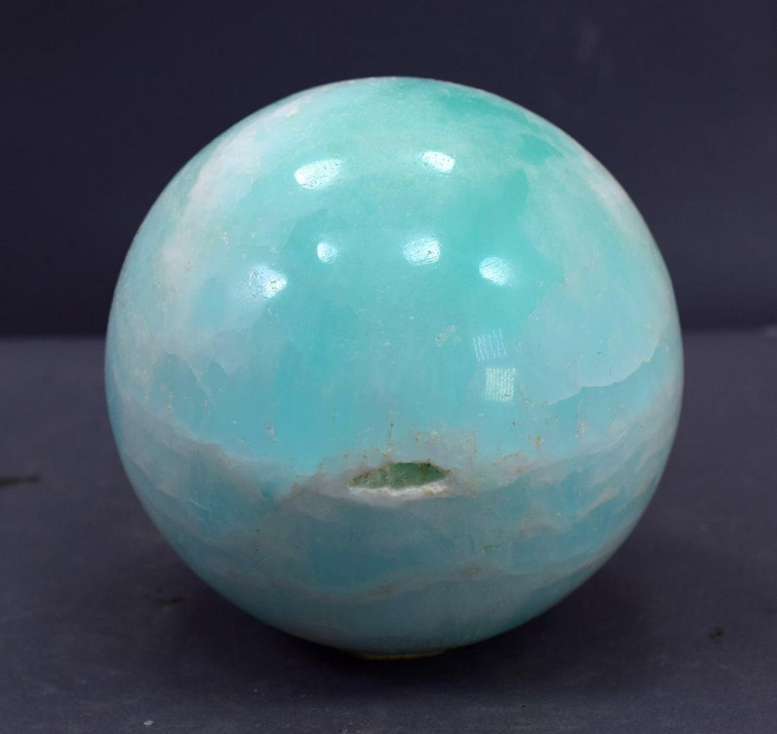 Carribean Calcite Sphere Ball , Blue Calcite Gemstone: Materials: carribean calcite, calcite Description Carribean Calcite Sphere Ball , Blue Calcite Gemstone Crystal Stone - 793 Gram , 81*81*81 mm This listing is for this exact Caribbean calcite aragonit