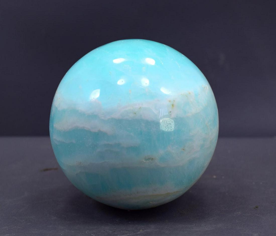 Carribean Calcite Sphere Ball , Blue Calcite Gemstone: Materials: carribean calcite, calcite Description Carribean Calcite Sphere Ball , Blue Calcite Gemstone Crystal Stone - 779 Gram , 81*81*81 mm This listing is for this exact Caribbean calcite aragonit