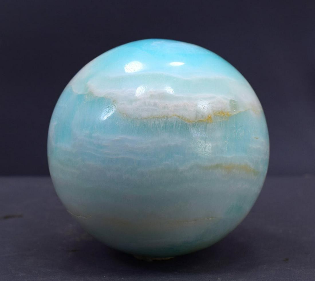 Carribean Calcite Sphere Ball , Blue Calcite Gemstone: Materials: carribean calcite, calcite Description Carribean Calcite Sphere Ball , Blue Calcite Gemstone Crystal Stone - 790 Gram , 80*80*80 mm This listing is for this exact Caribbean calcite aragonit