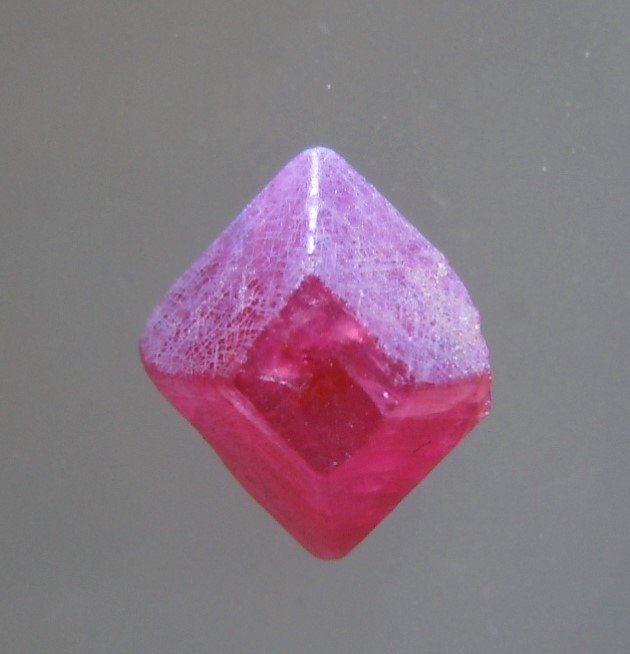 1.45 CT PYRAMIDAL RUBY CRYSTAL - UNTREATED: Title: 1.45 CT PYRAMIDAL RUBY CRYSTAL - UNTREATED Origin: Mogok Township, Mandalay Region, Myanmar Size: 0.8x0.54x0.35 cm / 0.29 gram Additional Information: vivid red pyramidal, translucent ruby crys